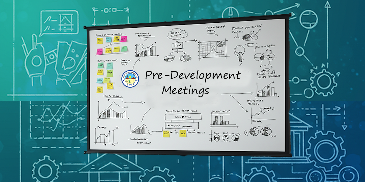 A group of professionals engaged in a pre-development meeting, discussing plans and strategies around a conference t